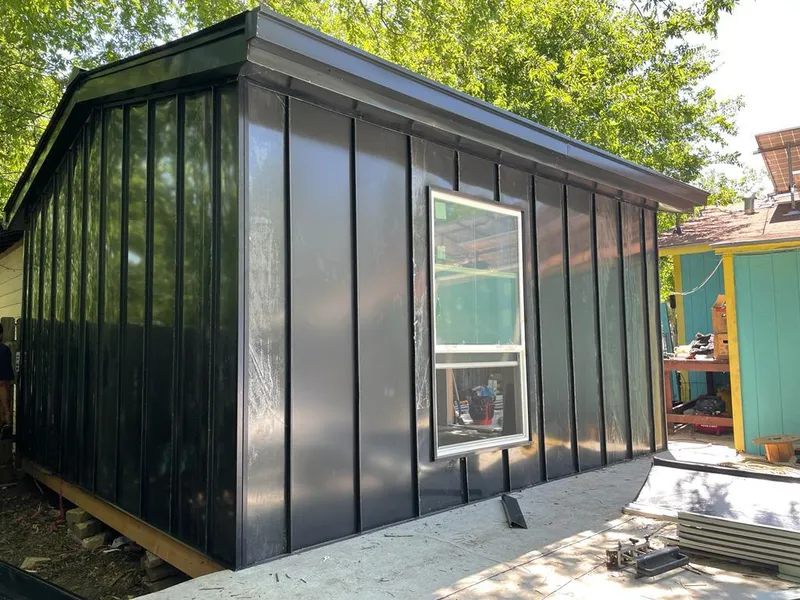 Black standing seam metal wall panels for Roof Inspection in West Livingston