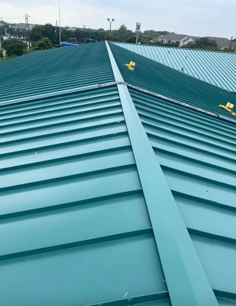 Green commercial metal roof ridge and valley for Metal Roof Repair in West Livingston